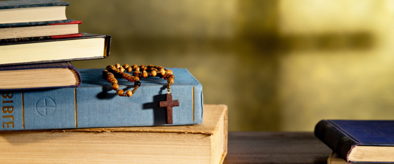 rosary and books